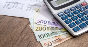 calendar, euros and calculator, coin placed on a table